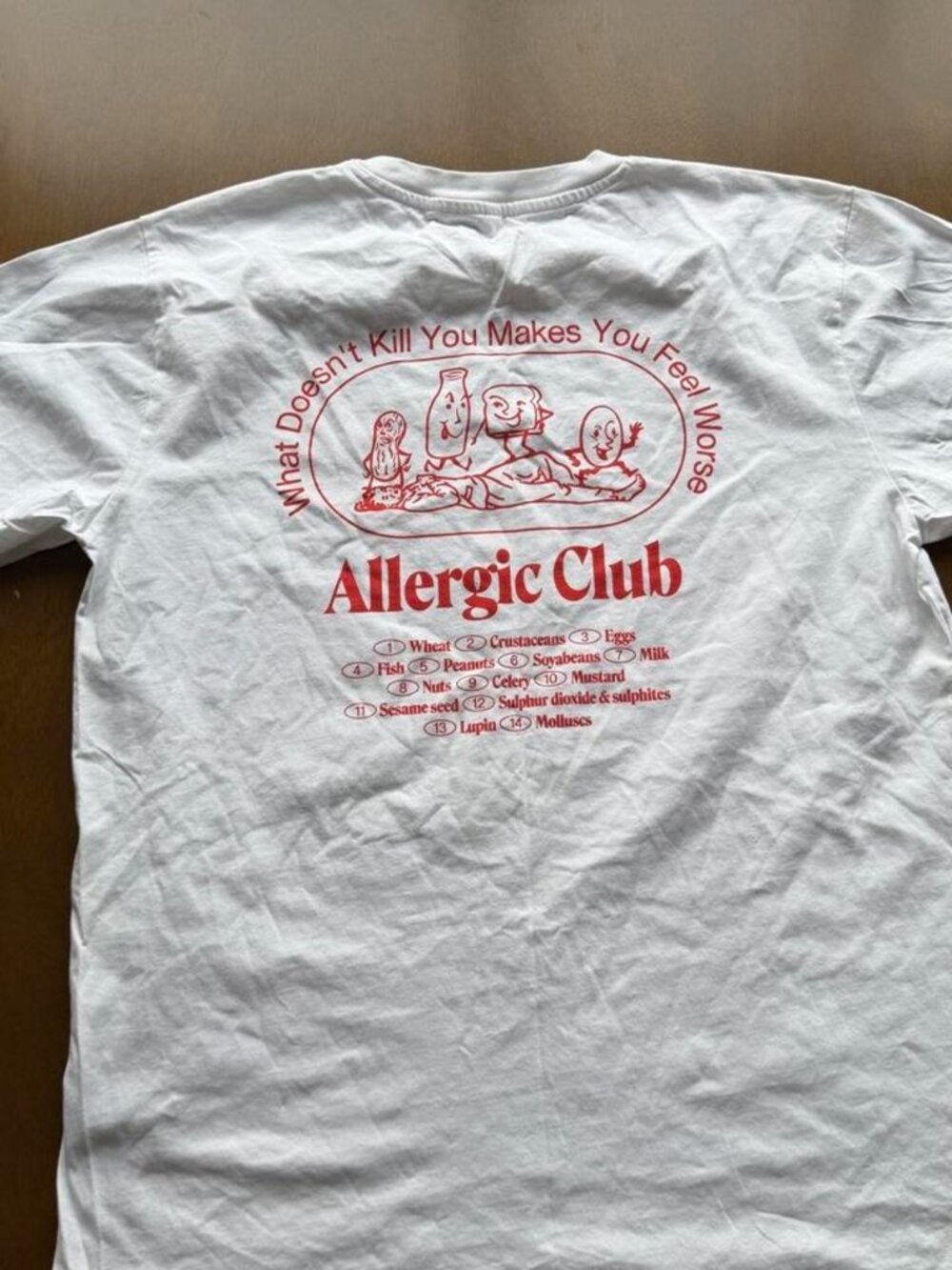White Allergic Club t-shirt with red text, size L